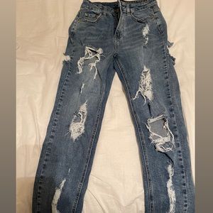 Fashion Nova ripped boyfriend jeans.